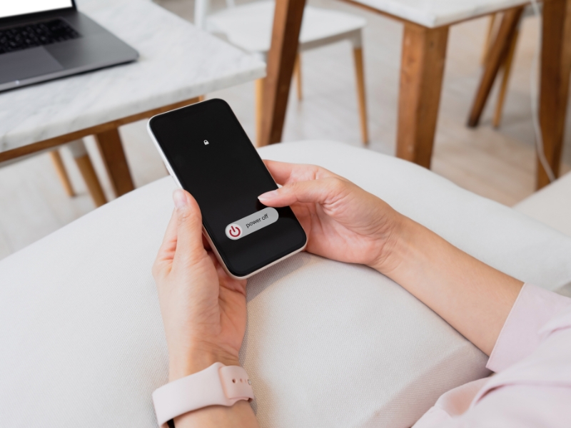 woman putting phone away to avoid distractions