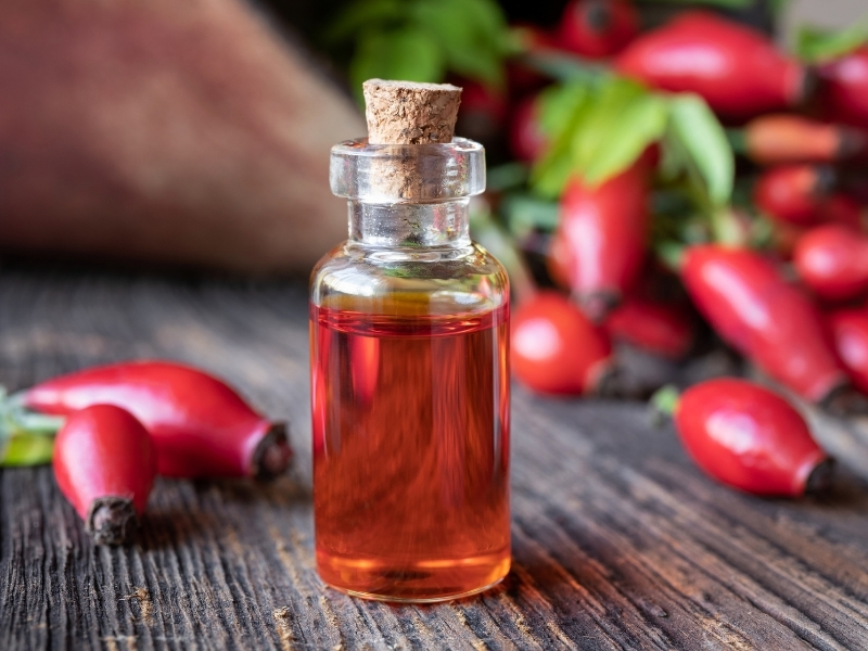 woman applying rosehip oil