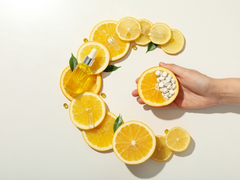 woman applying vitamin C serum