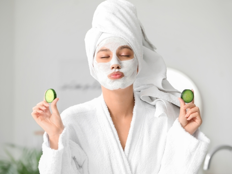 woman using cucumber slices for dark circles