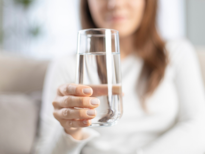 woman drinking water in the morning