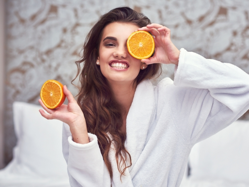 woman using vitamin C serum for dark circles