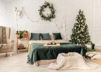 Cozy holiday bedroom decor ideas for a warm Christmas vibe with festive bedding, lights, and seasonal accents