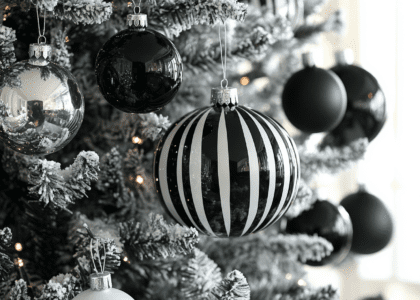 Elegant black and white striped Christmas tree ornaments with silver wire, featuring contrasting black glass baubles for a sophisticated winter wonderland theme.