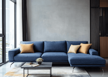 Fashionable living room by photographer Chen Man featuring a deep blue fabric sofa with metal legs, dark gray and beige color scheme, retro industrial-style background wall, and natural light streaming through large windows, creating an elegant atmosphere with luxurious design elements.