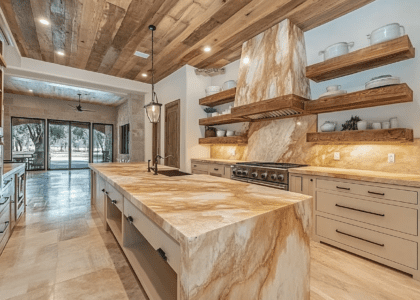 Rustic kitchen with wood and marble accents, featuring floating shelves, an island countertop, white oak ceiling, natural stone backsplash, and earth tone colors inspired by nature.